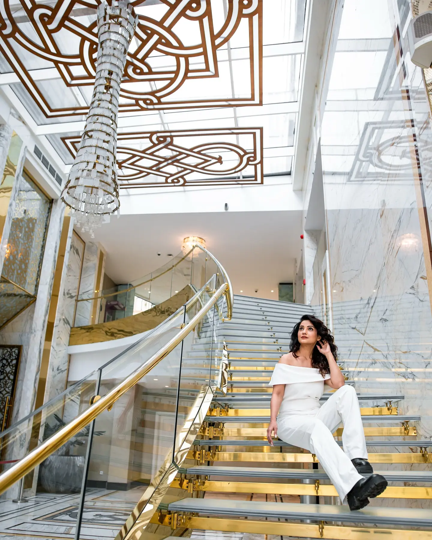 Adaa Lights Up Tbilisi In All White Adaa dazzles in pristine white at Tbilisi, showcasing her chic travel style and elegance.