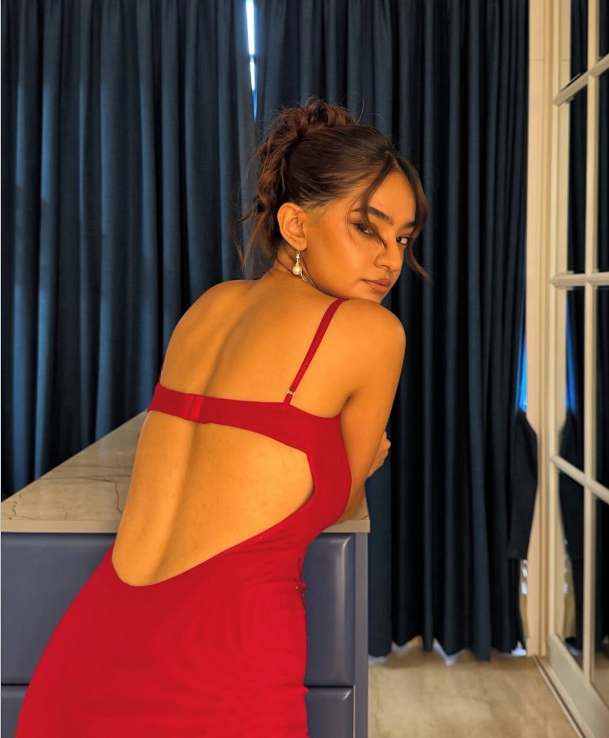 Anushka Sen Stuns In Fiery Red Gown Bollywood beauty Anushka Sen dazzles in dramatic red gown, exuding elegance and confidence.