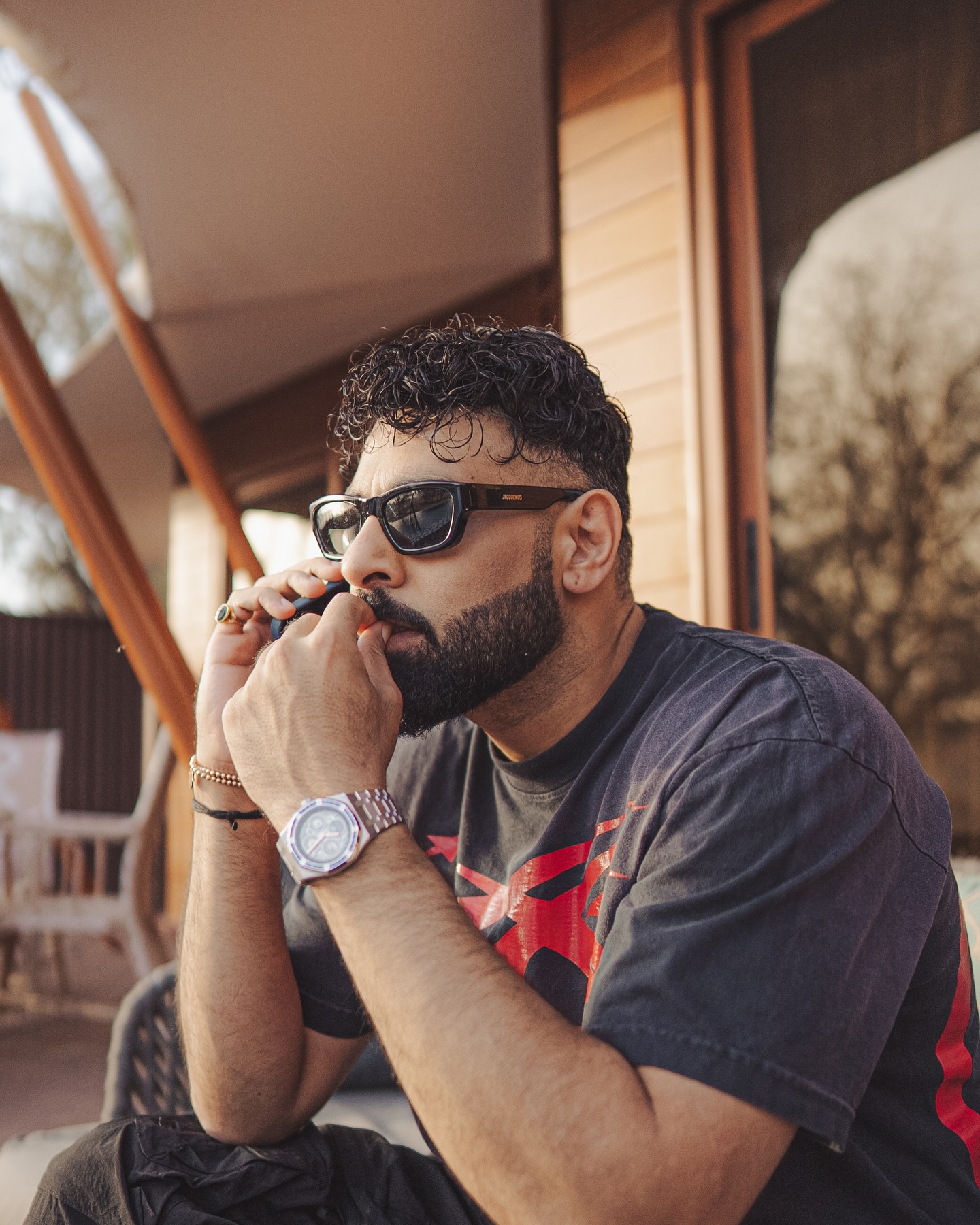 Badshah ignites urban scenes, blending sleek fashion with fierce tribal instincts, boldly.