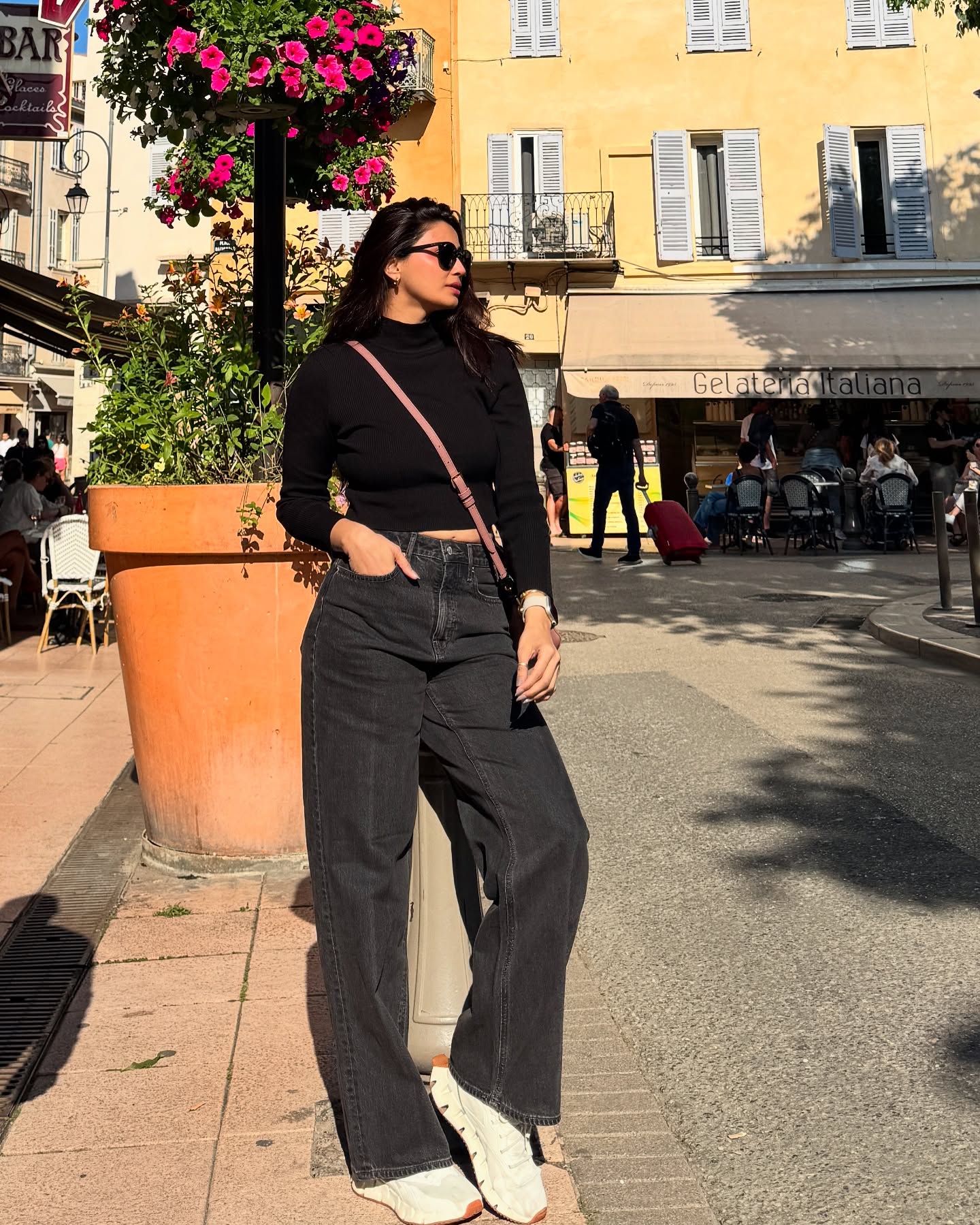 Bold black tones define her Paris-inspired aesthetic.