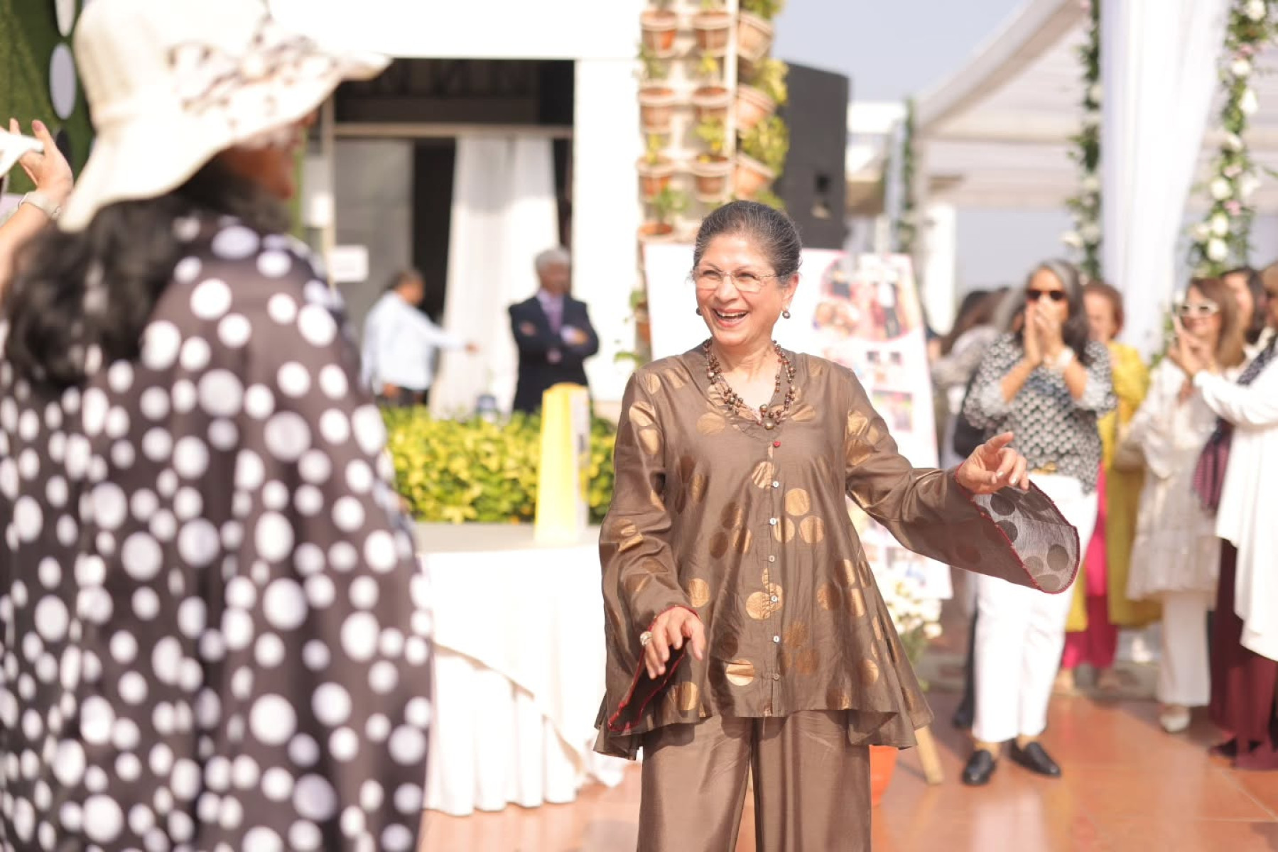 A vibrant celebration of a spirited mother marking her 70s with ‘Polka and Pearls’ charm and family unity.