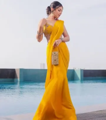Radiant golden moments capture Ishita Chauhan's impeccable Indian couture style at sunset!