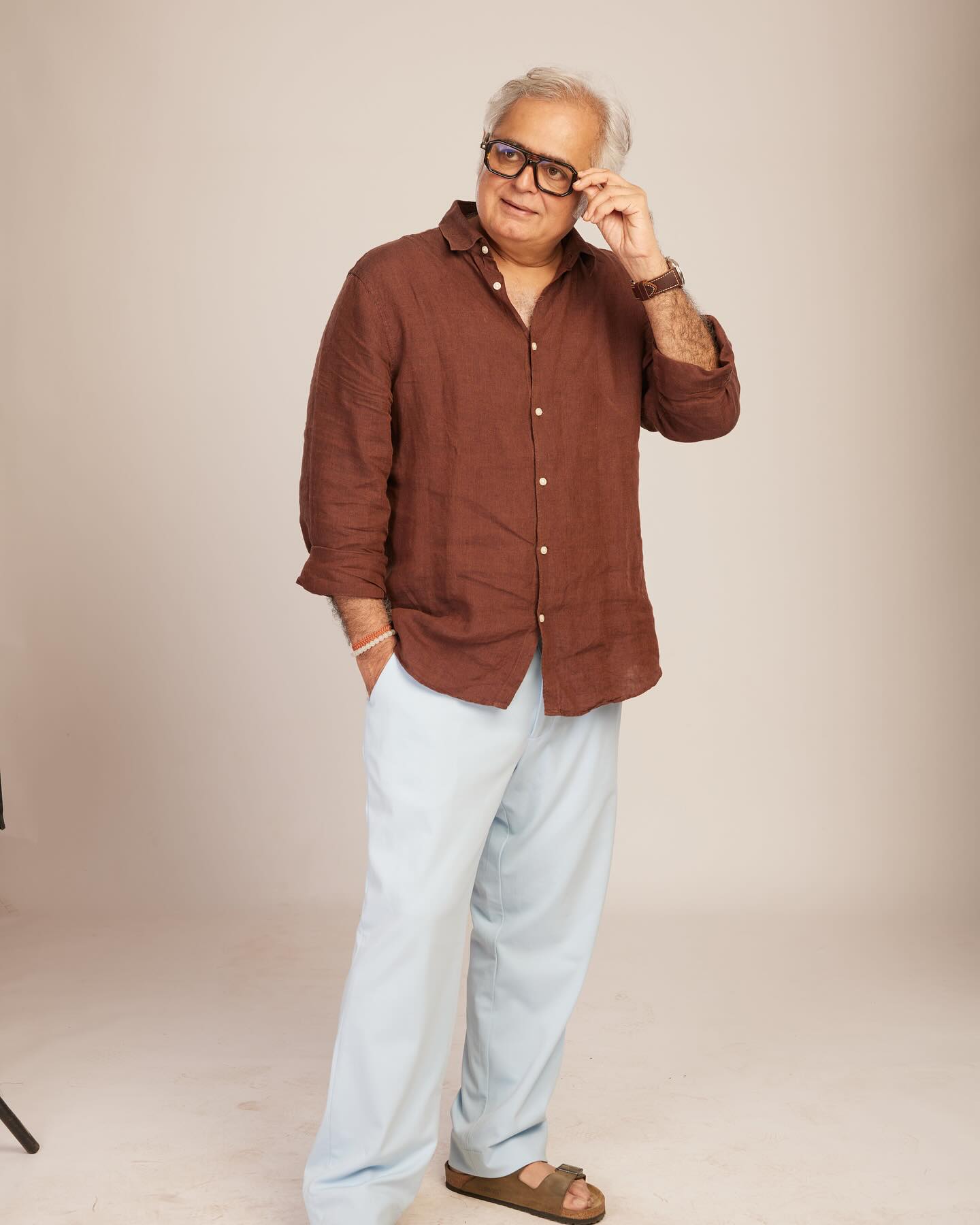 Hansal Mehta Embraces Minimalist Style Filmmaker shows style with linen, trousers, sandals, & timeless flair & pure charm. Truly!
