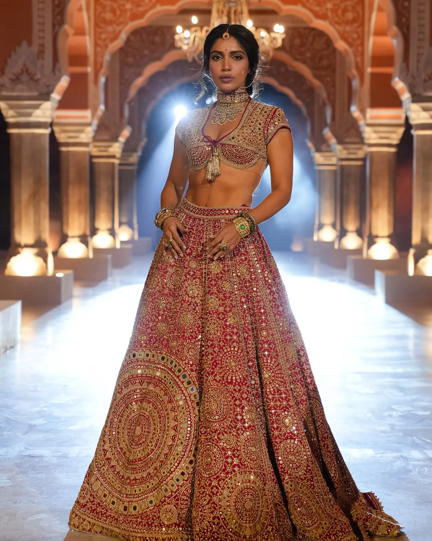 Bhumi’s handcrafted red ghagra dazzles with over 5,000 mirrors in a statement finale look.