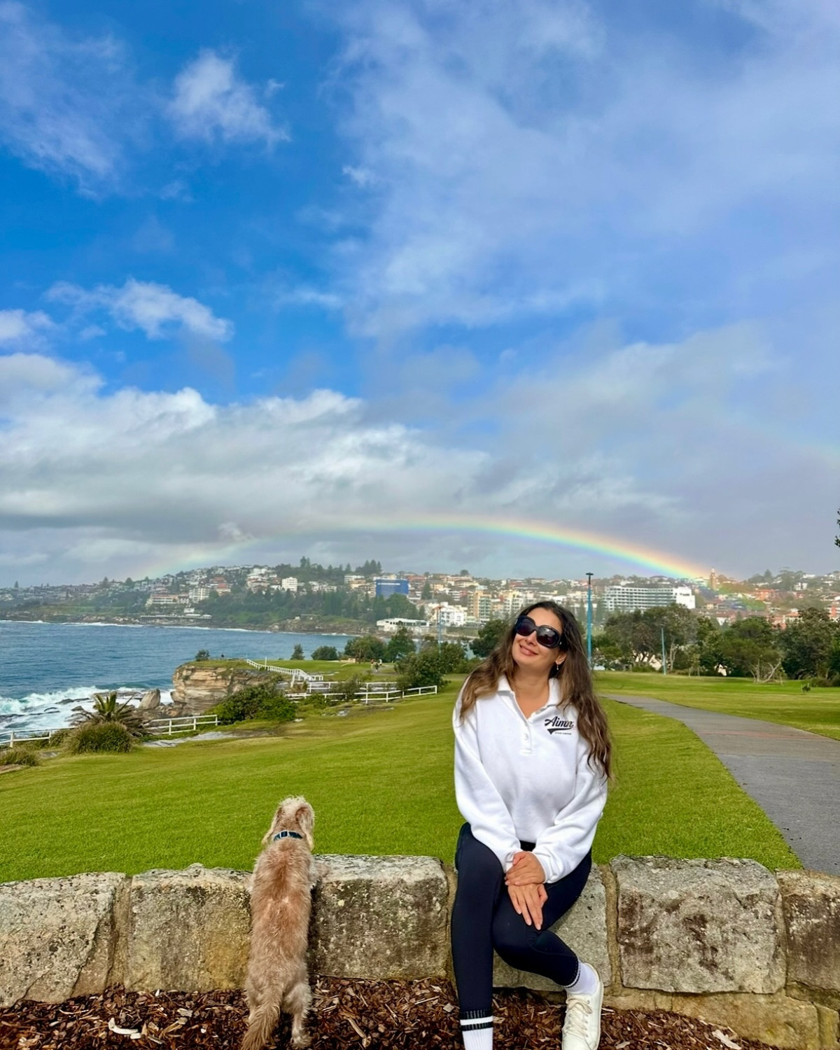 Nature’s Rainbow: Beauty After The Storm Strolling with Coco, Evelyn discovers nature's vibrant promise: calm skies after the storm