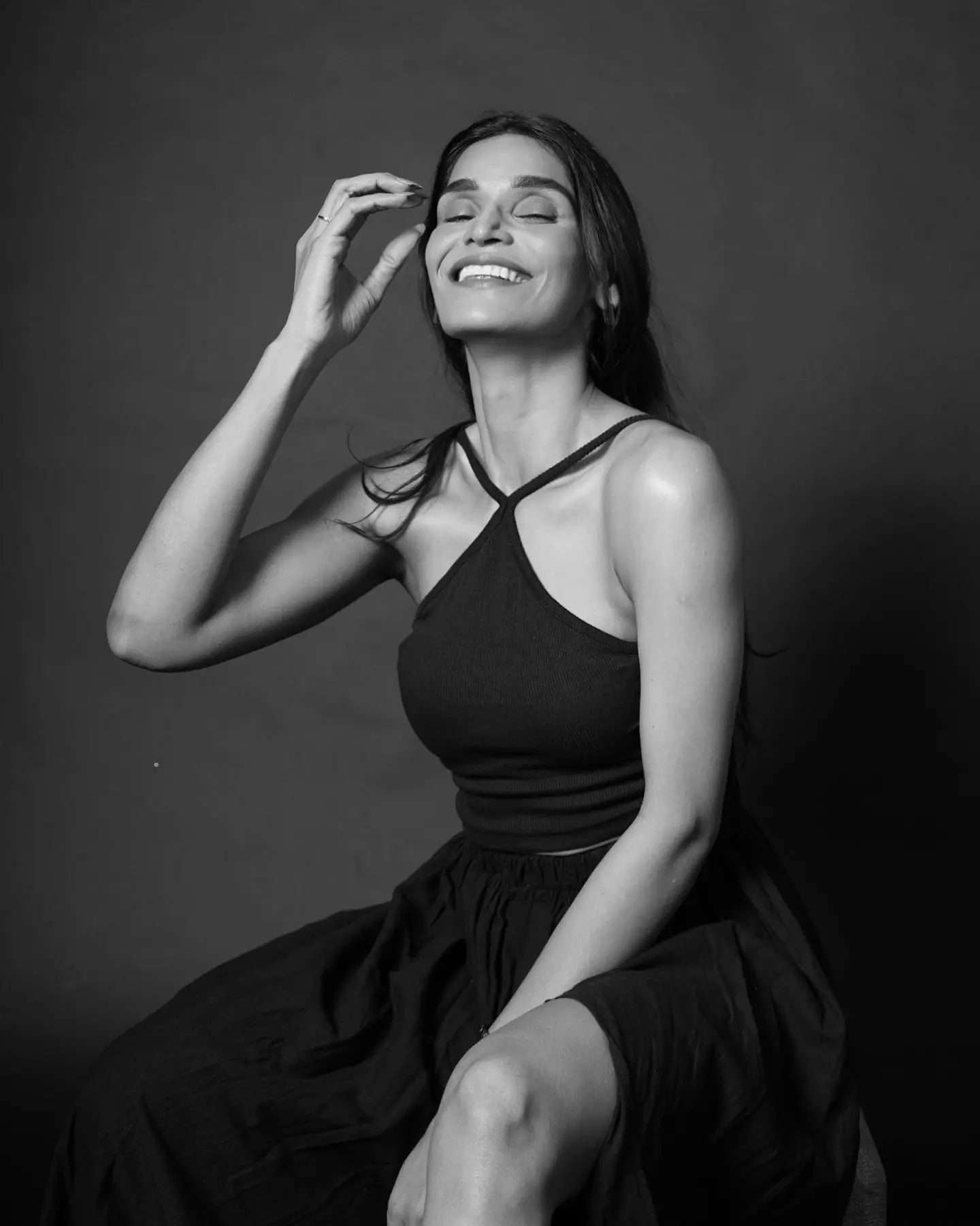 Neeha Exudes Charm In Monochrome Instagram Post Neeha charms with playful elegance, laughing at chaos in a vivid monochrome polaroid vibe!