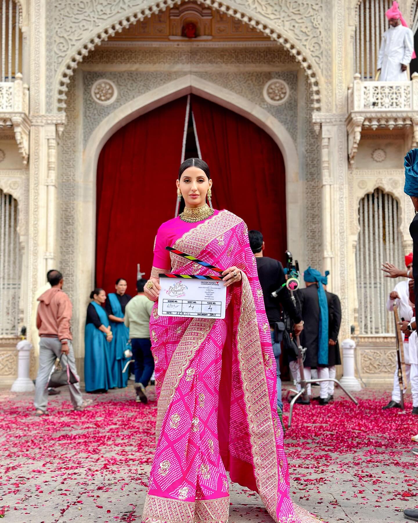Elegant pink saree transformation on The Royals set, fusing cinema charm with fresh style.