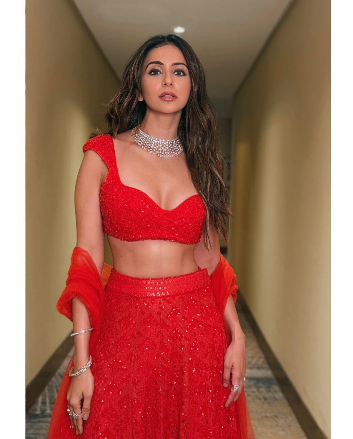 Rakul Preet Singh In Red Drama Explore Rakul Preet Singh's vibrant red hues capturing both fashion and cinematic essence.