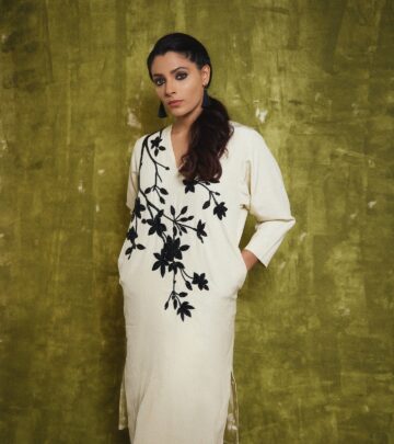 The actress displays timeless charm in a graceful, traditional ensemble.