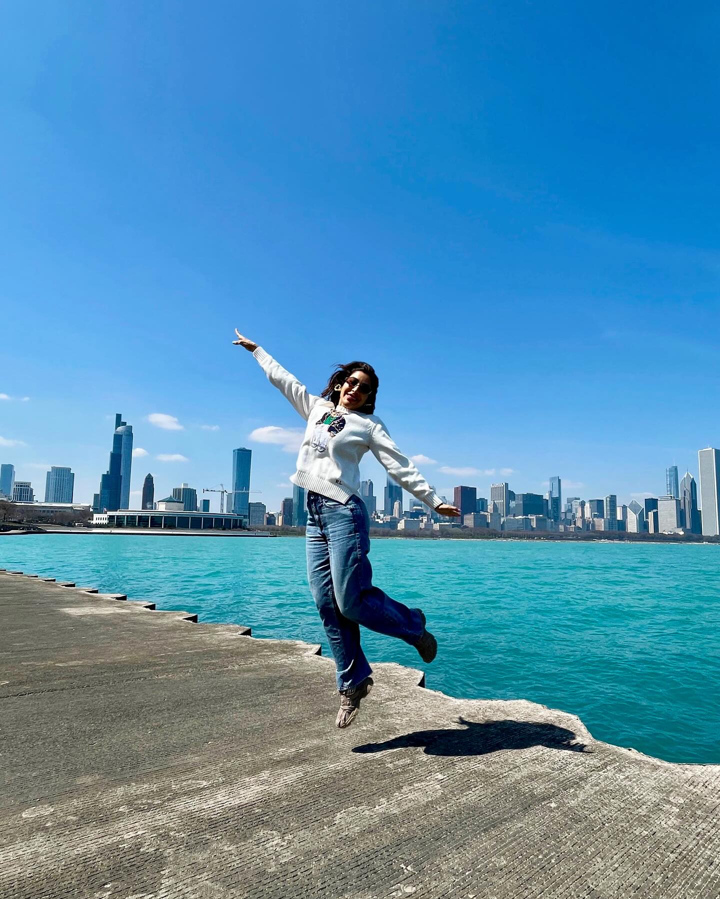 Lakeside in Chicago, she soaks up vibrant hues, cool vibes, and travel memories