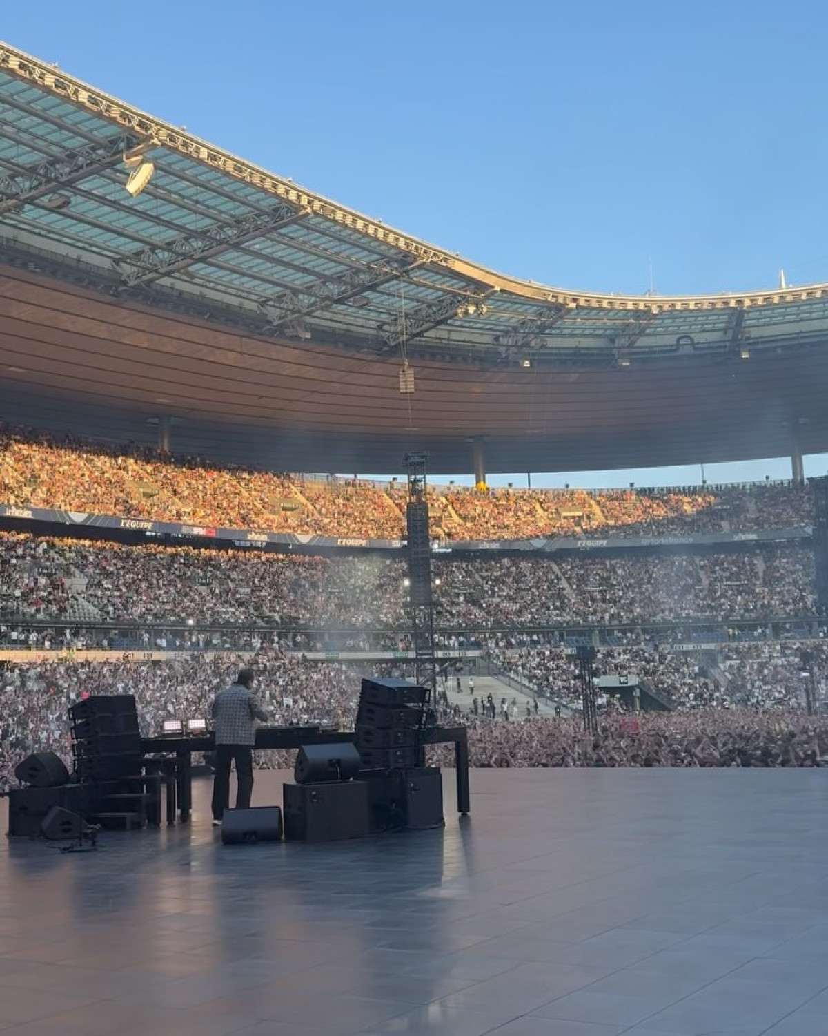 Legendary DJ Tiësto lights up Paris with pulsating beats and vibrant cityscape energy now!