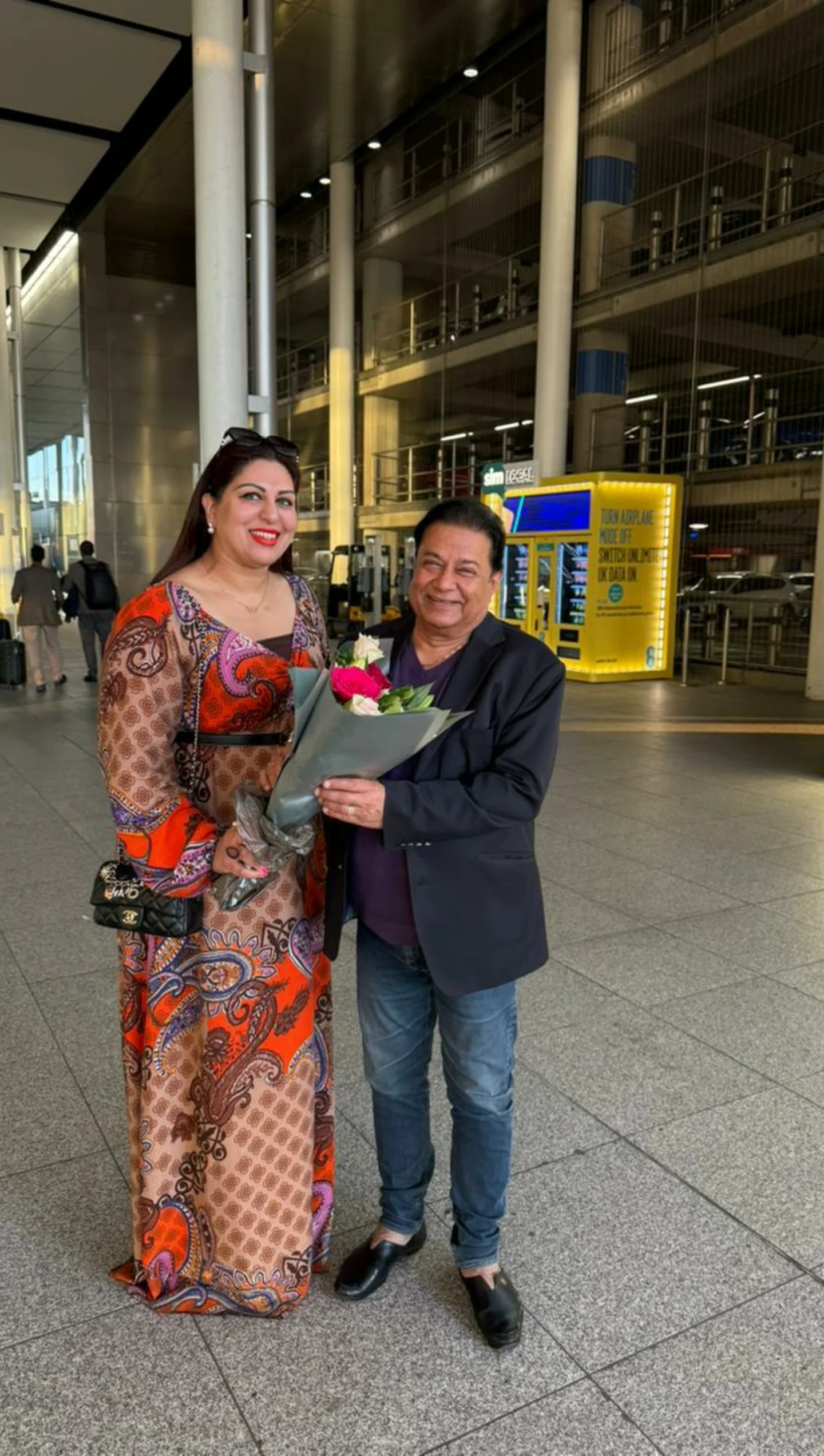 Warm London Arrival For Anup Jalota Icon lands in UK as event manager Maria greets with warmth, signaling fresh starts ahead!!