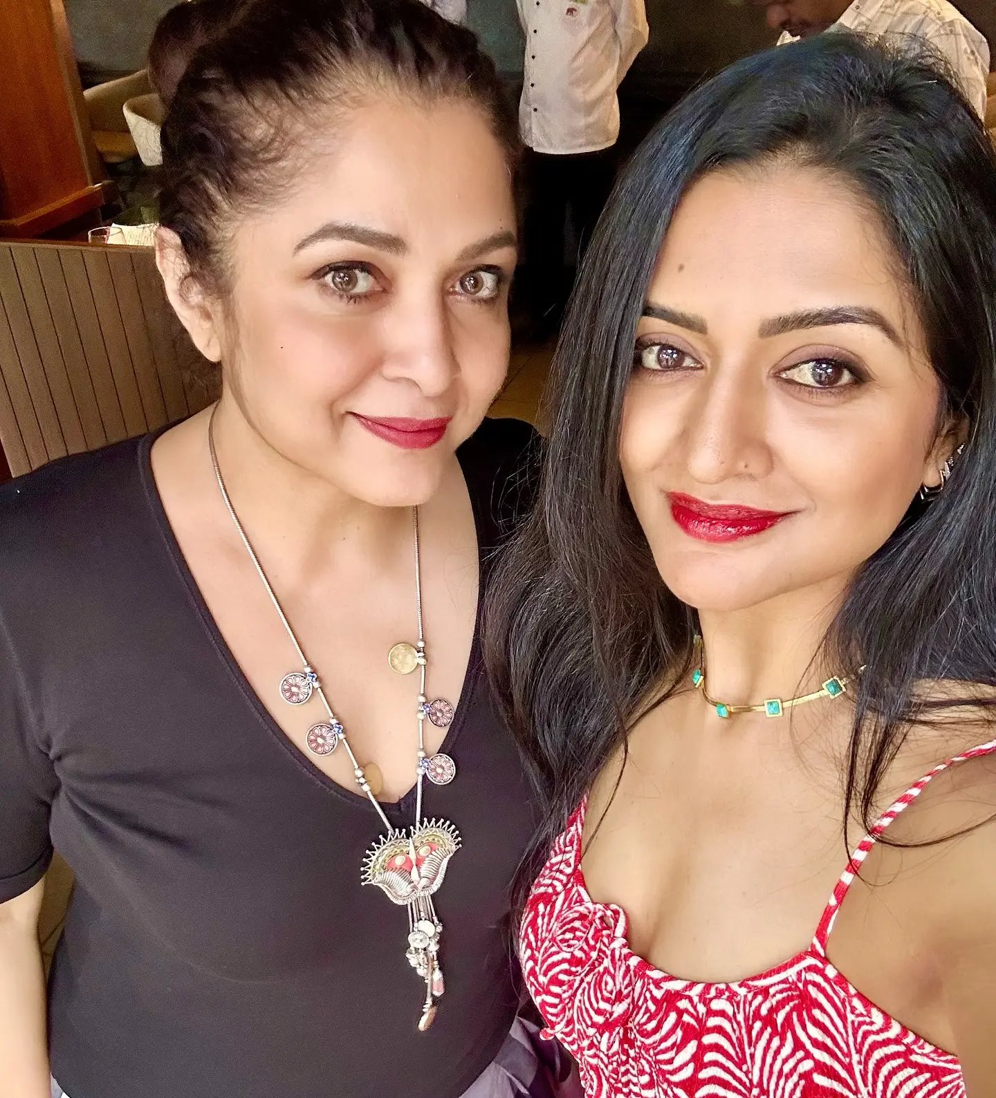 When Left Sock Meets Right Vibe Vimala Raman dazzles in quirky style at a mysterious door, blending urban chic with flair!
