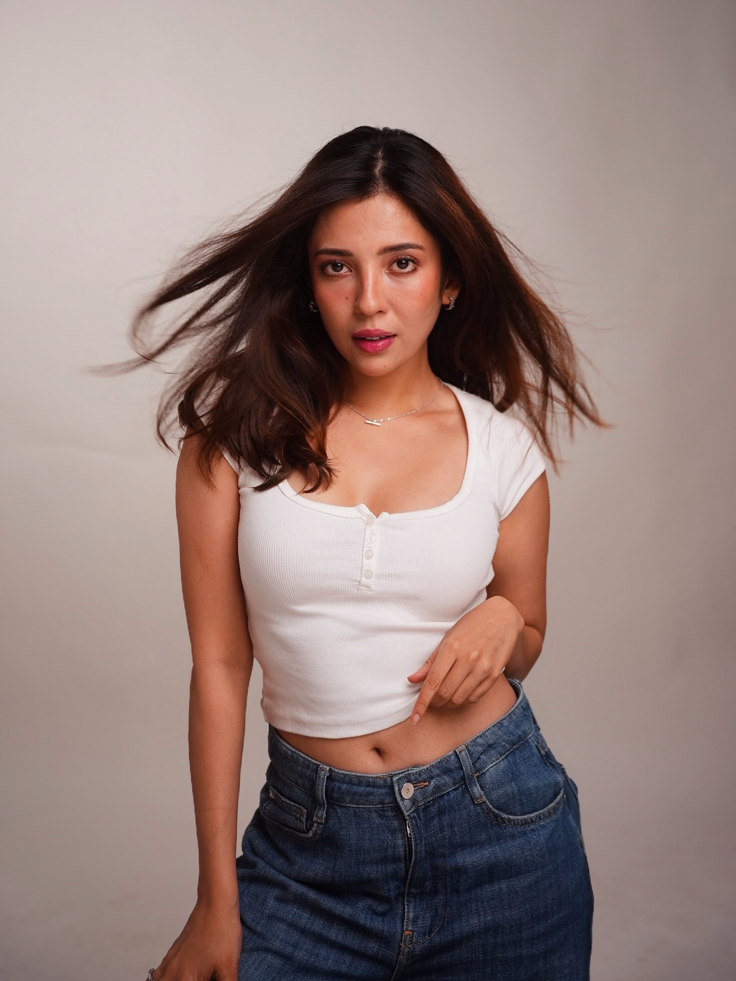 Barkha Singh Shines in Studio Portrait Shoot Celebrity Barkha Singh dons a crisp white tee and blue jeans in a dynamic studio shoot now