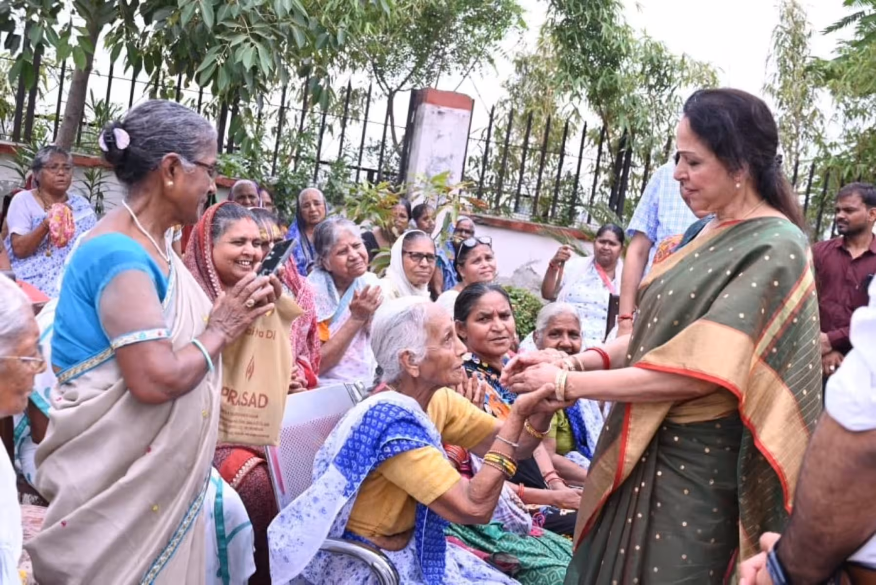 Hema Malini Supports Vrindavan Widows Hema Malini donates a golf cart to help aged widows reach their sacred temple in Mathura.