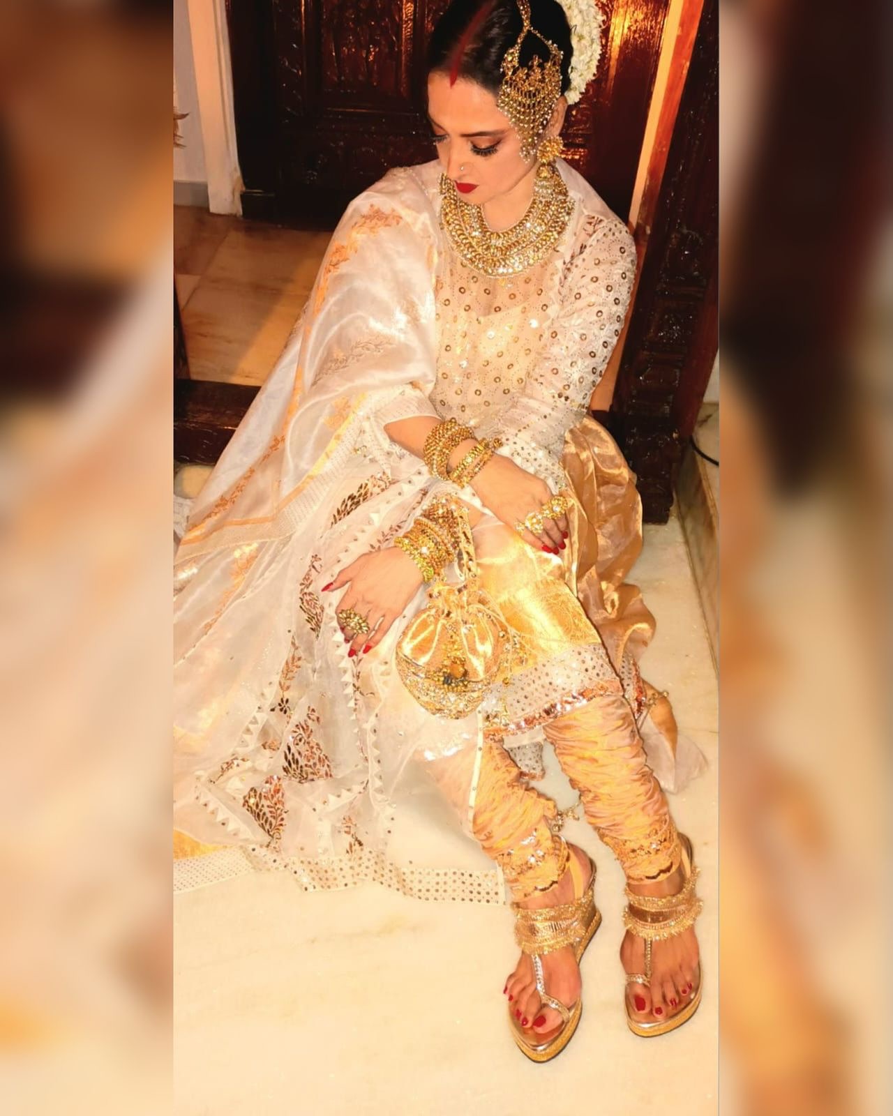 Rekha Radiates in Custom Gold Ensemble