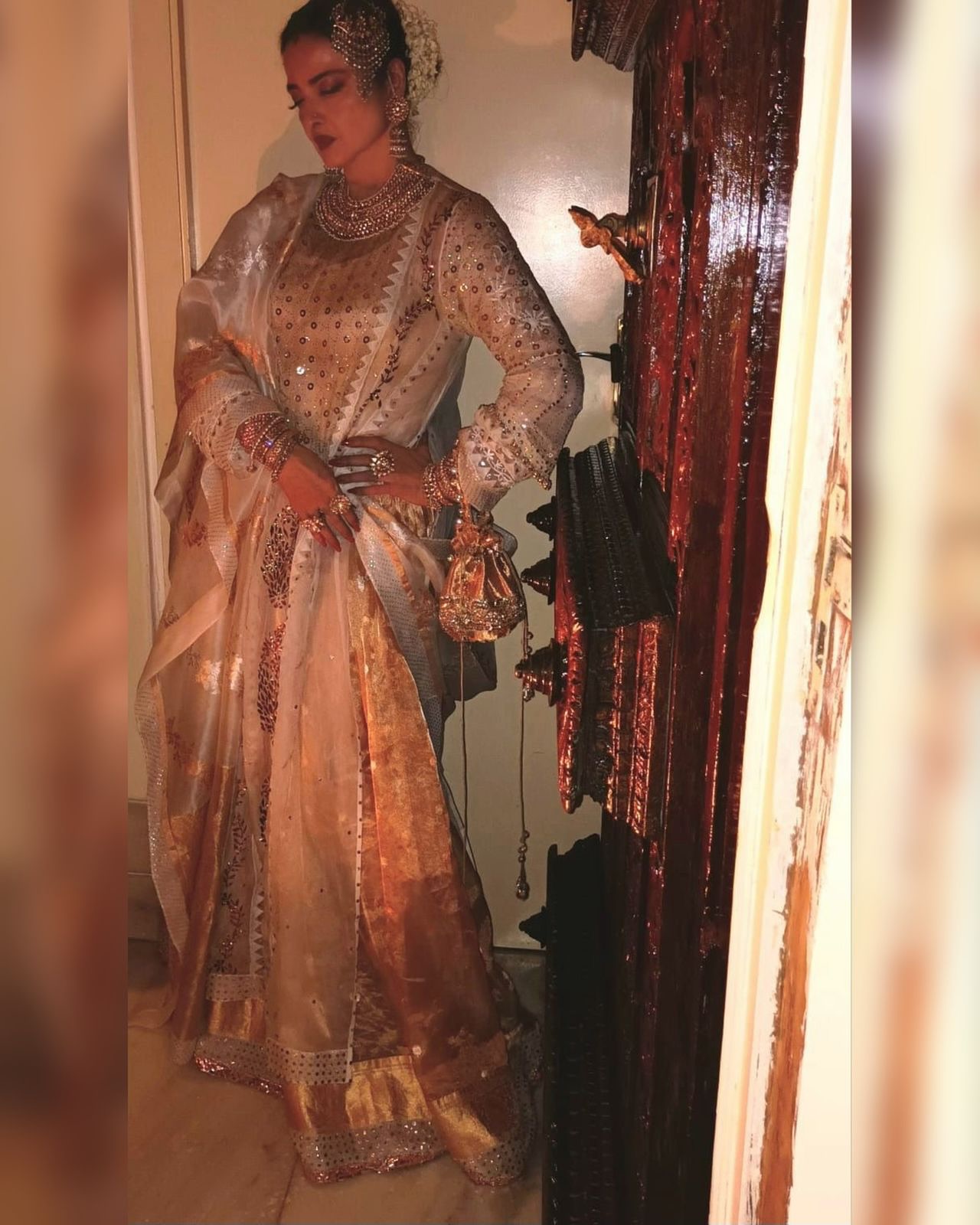 Rekha Radiates in Custom Gold Ensemble
